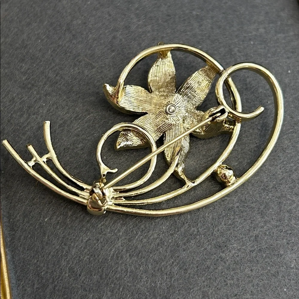 Gold-Tone Floral Brooch with Red Crystal Accents